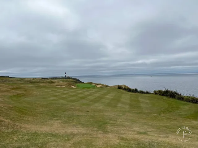 A wide hole at Old Head, the fairway following the curve of the cliff.