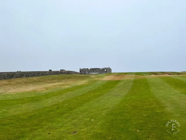 Golfers on the tee of a cliff hole at Old Head.
