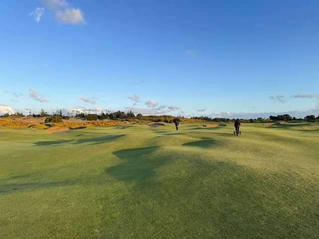 A tee view at Old Macdonald looking down a fairway toward the ocean.