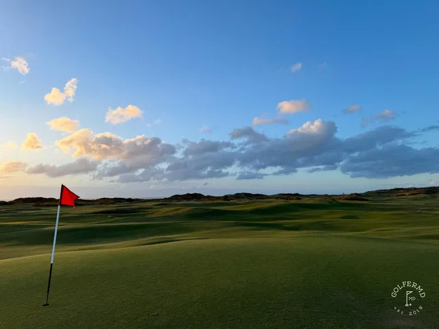 A fairway at Old Macdonald bending toward the ocean, with a bunker on the right.