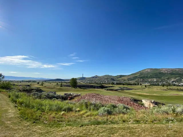 A fairway at Old Works with black waste areas on both sides.