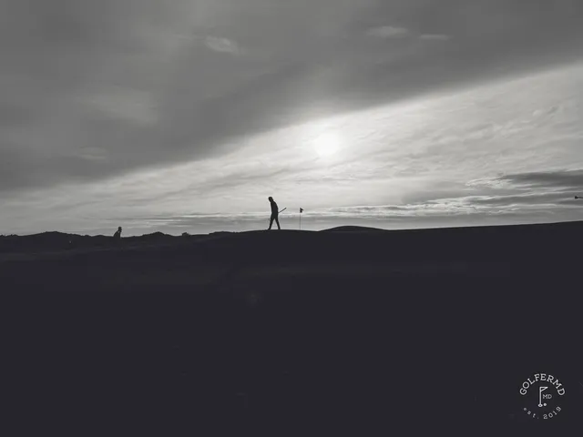A fairway at Pacific Dunes with a bunker along one side and the water ahead.