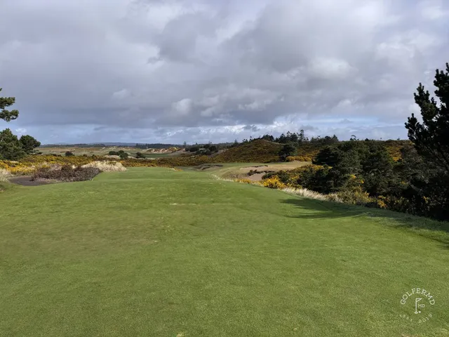 A last wide view of Pacific Dunes, with the course in front of the ocean.