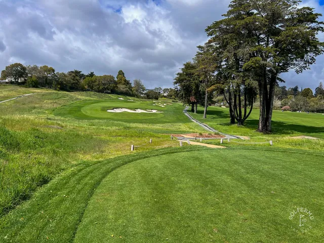 A green and flagstick among the trees at Pasatiempo Golf Club.