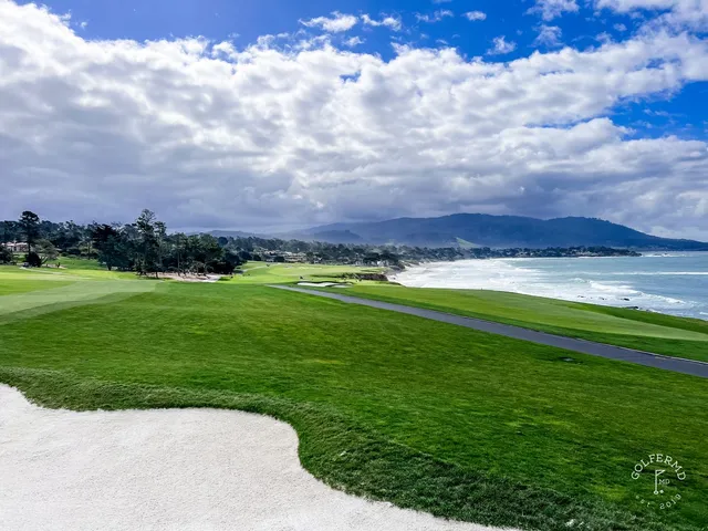 Looking down a fairway toward a green and the ocean at Pebble Beach Golf Links.