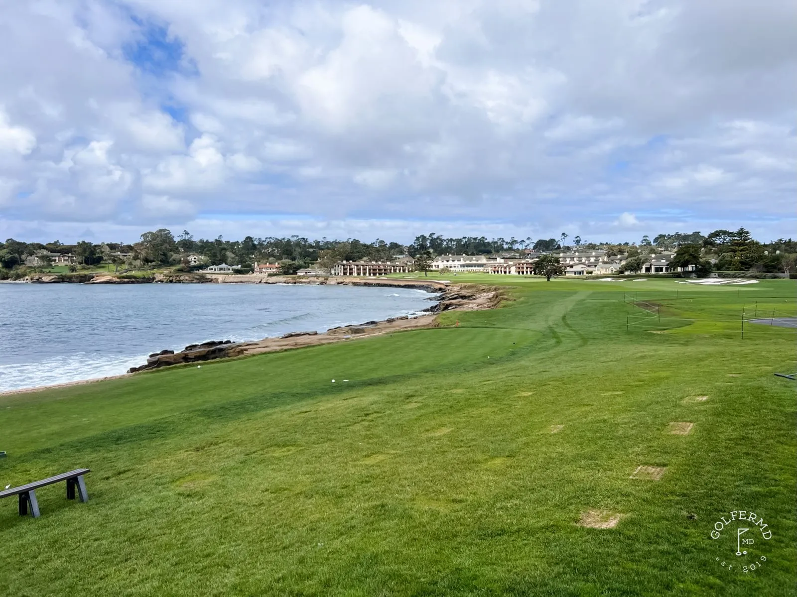 The lone cypress on its rocky point at Pebble Beach Golf Links, with the ocean behind it.