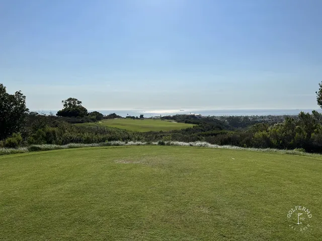 The ocean and the coastline from the bluffs at Pelican Hill Ocean North Course.