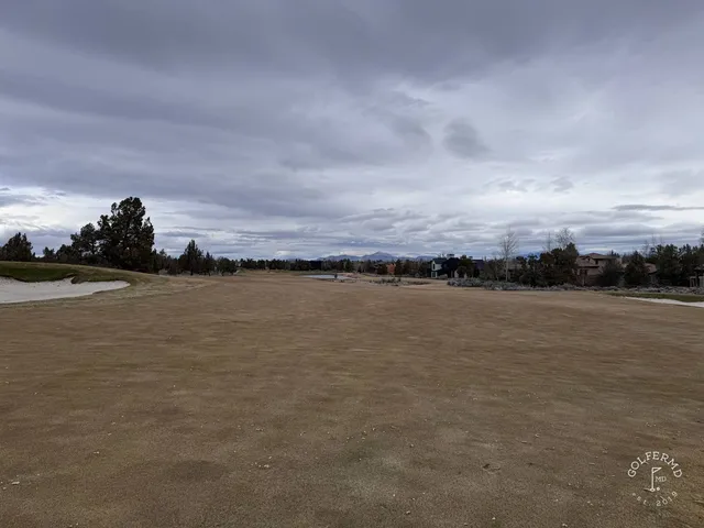 Golfers on a tee at Pronghorn, with the high desert behind them.