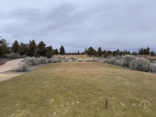 A wide fairway at Pronghorn, with the Cascades in the distance.