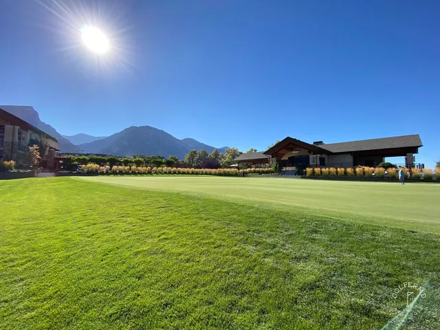 A wide view at Riverside Country Club, with the fairway and the mountains on the horizon.