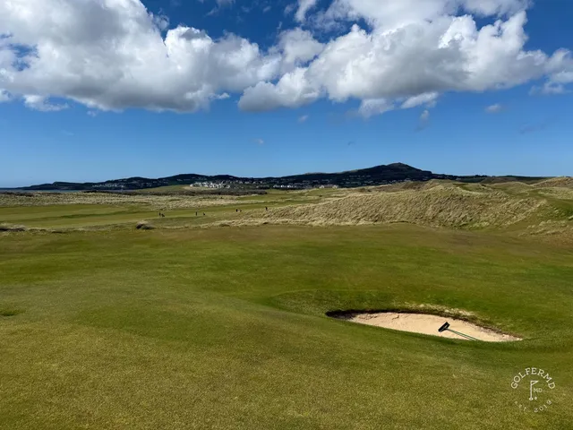 Golfers on a tee on the Sandy Hills, with the Atlantic behind them.
