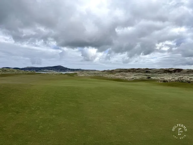 Golfers on a tee on St. Patrick's, with the Atlantic behind them.