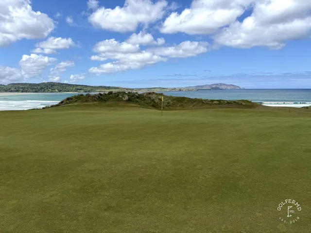 A wide hole on St. Patrick's, the fairway running toward the Atlantic.