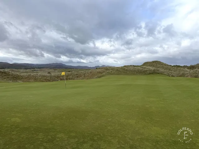 A green and flagstick on St. Patrick's, seen from above the hole.