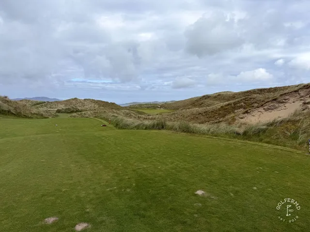 A last wide view across St. Patrick's, with the fairway and the Atlantic.