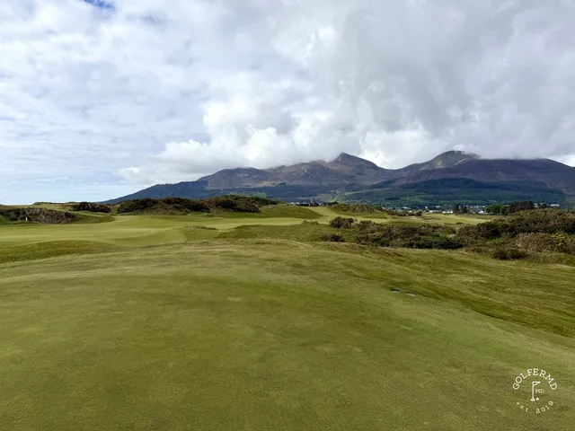 A fairway on the Annesley Links running toward Dundrum Bay, with the Mournes beyond.