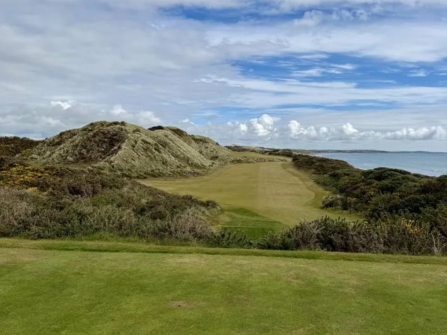 A fairway on the Annesley Links with a bunker on the right and the mountains ahead.