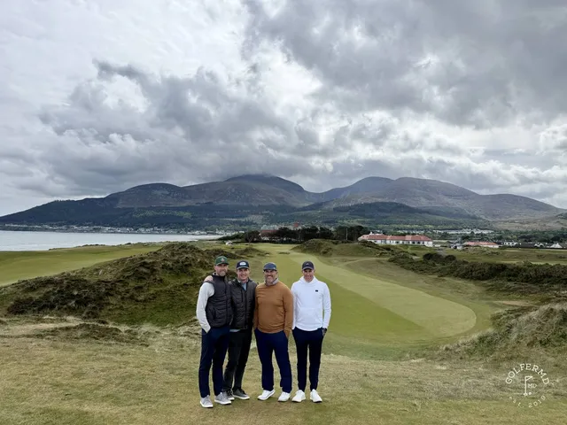 Dundrum Bay and the links at Royal County Down under a cloudy sky.