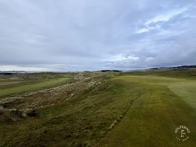 A last wide view of Royal Portrush, the course spread toward the Atlantic.