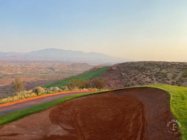 A tee shot at Sand Hollow looking down a fairway toward the red rock formations.