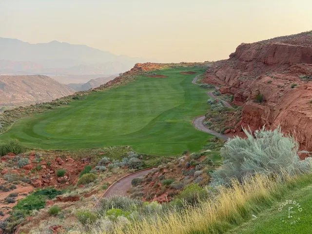 A fairway at Sand Hollow with a bunker on the left and the red rock in the distance.