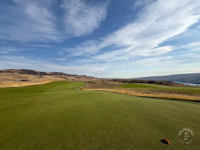 An elevated view at Scarecrow, the holes spread across the sand toward the hills.