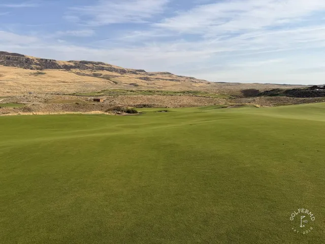 A last wide view of Scarecrow at Gamble Sands, sand, fescue, and the mountains.