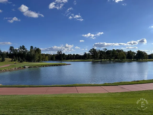 A green at SentryWorld with the flagstick and a bunker beside the hole.