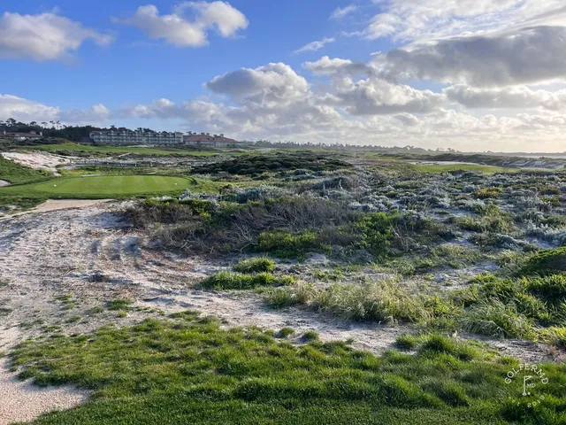A fairway toward the ocean at The Links at Spanish Bay, with dunes along the hole.