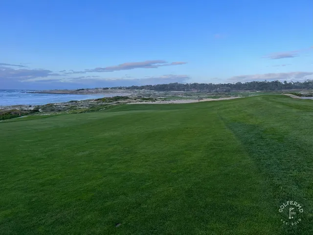 A green and flagstick above the ocean at The Links at Spanish Bay.