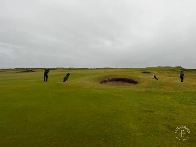 A fairway at Tralee with a bunker on the right and the water ahead.