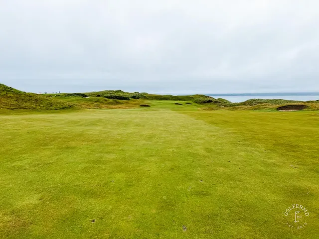 A carry across sand at Tralee, the fairway starting again beyond a waste area.