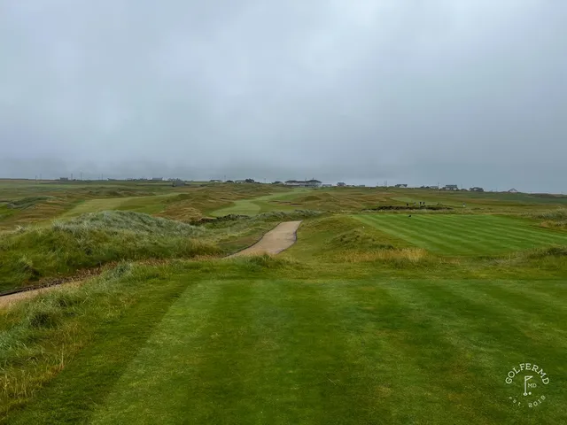 A final look back across the dunes at Tralee, with the Atlantic beyond the last green.