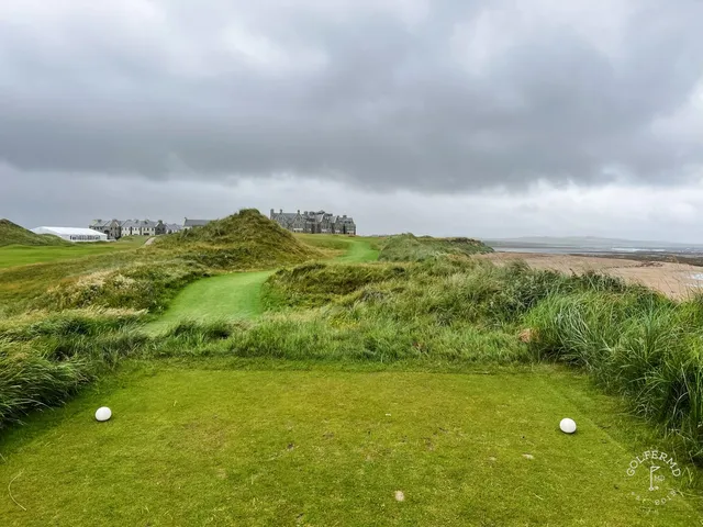 A wide hole at Doonbeg, the fairway set between sand hills and the Atlantic.