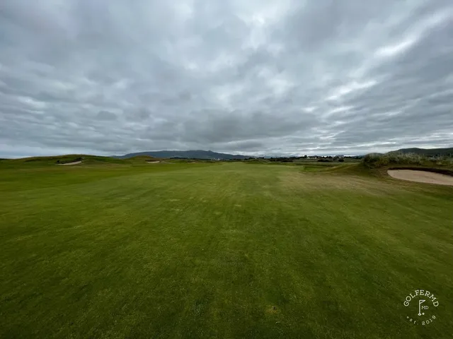 A fairway at Waterville Golf Links running toward the Atlantic, with the Kerry mountains beyond.