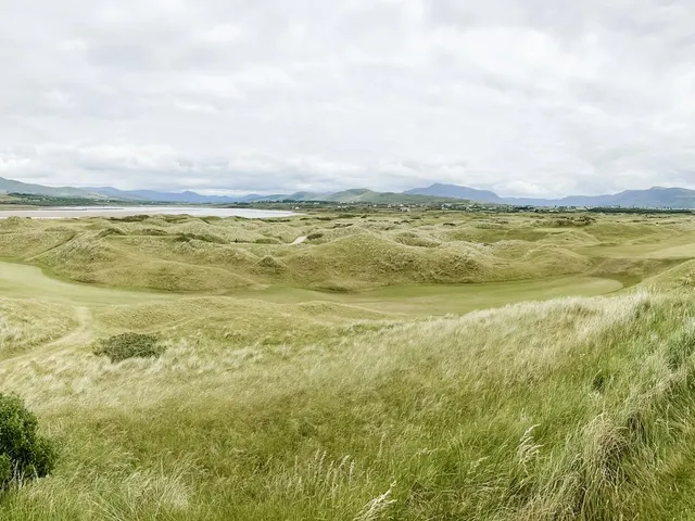 A wide panorama of Waterville Golf Links, with several holes and the Kerry coast.