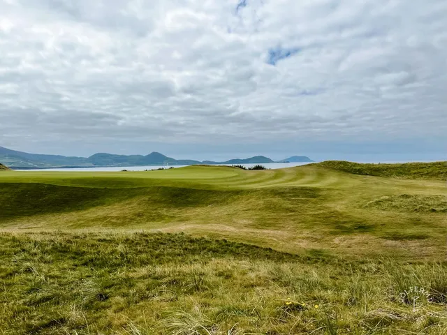 A tee shot at Waterville, the fairway dropping toward a green above the beach.