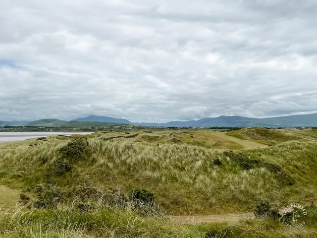 A fairway at Waterville running along the dunes, with the green in the distance.