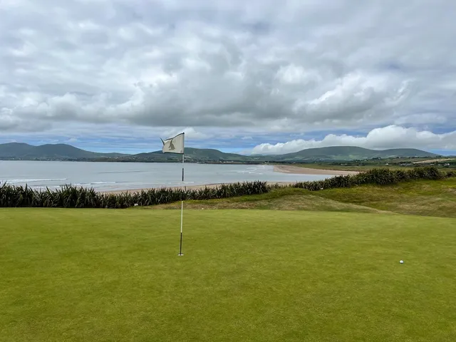 A fairway at Waterville running toward the water, with the dunes on both sides.