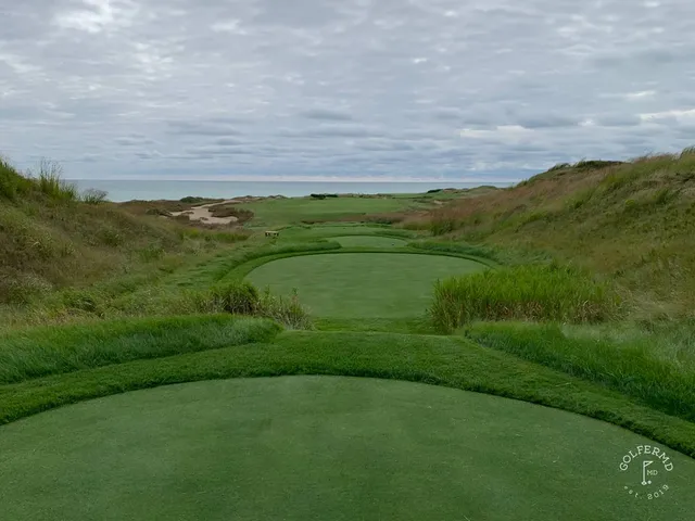 A fairway on the Straits Course with a bunker on the right and the water ahead.