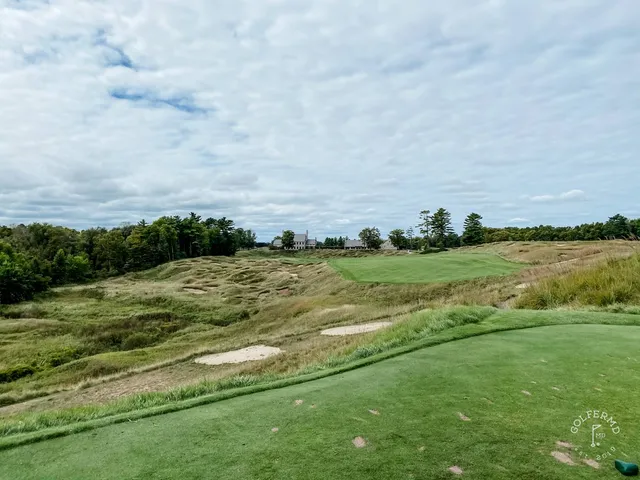 Another green on the Straits Course, the flagstick high above a front bunker and the water.