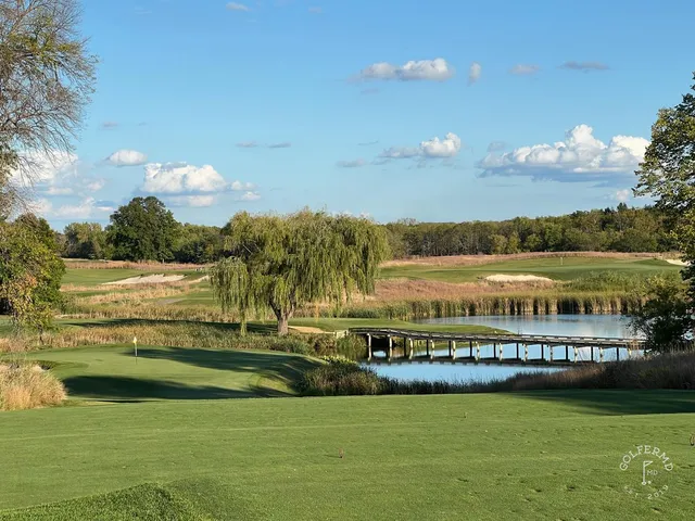 A fairway at Windsong Farm with a bunker along one side and fescue in the rough.