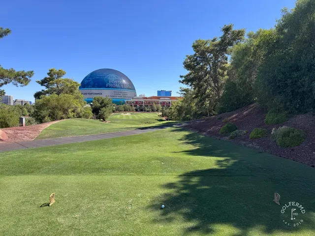 A last wide view of Wynn Golf Club, with the course in front of the Las Vegas Strip.